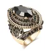 Joia Bohemia Estilo Aristocrático de Luxo Leve Anel com Zircônia de Cristal Inlaid Rodeado por Pequenos Diamantes com Textura de Obsidiana