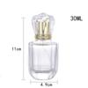Botella de perfume de vidrio transparente al por mayor, 30 ml, elegante, portátil, mini, con pulverizador de niebla fina, vacía.