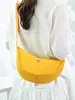 Bolso bandolera de nailon para mujer 2026 nuevo bolso de moda tipo albóndiga ligero pequeño bolso de hombro bolso de axila versátil bolso de hombro de lona