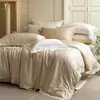 Ropa de cama de lujo ligero moderno, color sólido, encaje, alta gama, amigable con la piel y transpirable, juego de cuatro piezas de algodón Tencel, textil para el hogar