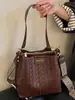 Bolsas de nicho de alta gama de moda para mujer 2026 nuevos bolsos de hombro de moda bolsos cruzados bolsos tipo cubo versátiles
