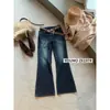 Su Xin Lan/YOUMO Colección Otoño Retro Americano Elástico en Cuatro Direcciones Patrón Ojo de Gato Jeans Ligeramente Acampanados Z6197 (con cinturón)