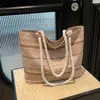 Bolso de Hombro Rayado de Paja de Gran Capacidad 2026 Verano Nuevo Moda Bloqueo de Color Moderno Simple Versátil