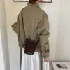 Bolso de mano retro de gamuza para mujer para otoño e invierno, nuevo bolso tipo cubo elegante y versátil 2026, bolso cruzado casual de nicho para el día a día