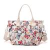 Bolsa feminina portátil transfronteiriça bolsa de múmia de ombro único estilo coreano vintage impresso design de nicho de alta aparência sacola de grande capacidade