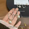 Pendientes de aro lisos con rosca de nuevo estilo, con un diseño suave y elegante, simples y versátiles, pendientes de alta gama al por mayor