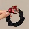 Goma para el pelo con bloques de color negro y rojo, con caballito dorado y símbolos de la suerte para el Año del Caballo, adecuada para coletas altas y accesorios para el cabello
