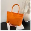 Bolsa de tela nueva transfronteriza color macarrón bolso de mano ligero versátil elegante bolso cubo nicho bolsa de transporte exterior para mujer