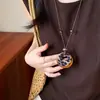 Collar de borlas acrílicas transfronterizo europeo y americano, sensación de lujo ligero y alta gama, cadena para la clavícula con diseño Maillard, joyería de nicho para mujeres