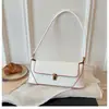 Bolso de hombro retro de alta gama para mujer, nuevo modelo primavera-verano 2026, bolso de mano versátil con textura de nicho, bolso baguette