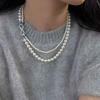 El collar de perlas de vidrio de doble capa con hebilla de 8 caracteres de Shijia se puede dividir en una cadena de suéter gris cáñamo multiusos.