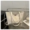 Bolsa Tote de Grande Capacidade para Mulheres 2025 Nova Moda Simples Bolsa de Mão Embossada Casual para Trabalho Roupa Bolsa de Ombro Axilar