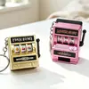 Llavero de máquina de premios modelo nuevo, mini colgante de máquina de juegos de frutas electrochapado, colgante de bolsa de juguete de máquina de sacudir retro