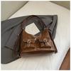 2025 Outono Nova Bolsa Tote Niche para Deslocamento Moda Feminina Casual Casual Popular Estilo Ocidental Mochila Bolsa de Ombro