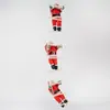 En stock para venta al por mayor: Papá Noel subiendo una escalera, Papá Noel subiendo una cuerda, Papá Noel subiendo una escalera invertida, Papá Noel en un columpio