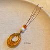 Collar de cuerda circular marrón para mujer, diseño de nicho, de alta gama, simple, de moda, estilo frío, estilo retro, cadena para el cuello.