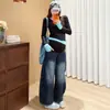 Jeans de maternidad estilo perezoso suelto azul grisáceo otoño e invierno sueltos que cubren la carne diseño delgado sentido de diseño pantalones de pierna ancha de moda