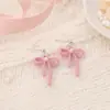 Novos brincos minimalistas transfronteiriços com senso de design, brincos de fita rosa, sensação de luxo leve e alta qualidade, atacado