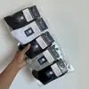 Calcetines empaquetados individualmente calcetines de media pantorrilla para hombre otoño e invierno absorbentes de sudor transpirables calcetines de media pantorrilla para hombre de negocios color liso antiolor Zhuji
