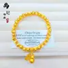 Tienda de oro con cuentas de transferencia de color esmalte de arena dorada antigua doble feliz cobre chapado en oro moda gato Joker ojo de gato pulsera al por mayor