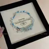 Libro Rojo Pequeño Mismo Estilo Dulce Pulsera de Mariposa de Grava Azul Moda Alto Sentido Tejido a Mano Cuerda de Mano de Perla Delfín
