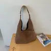 Bolsa de ombro minimalista transfronteiriça, grande capacidade, design novo e moderno 2026, estilo nicho, bolsa tote de axila, bolsa de mão feminina