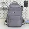 Mochila Escolar Grande Capacidade Estudante 2025 Novo Estilo Simples Tecido de Nylon Repelente à Água Mochila Casual de Viagem Mochila Feminina