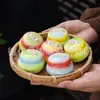 Pote cerâmico degradê, um produto cultural e criativo popular na área cênica, apresentando um estilo chinês tradicional e técnicas antigas, e contendo incenso sólido