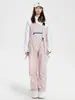 Liquidación de pantalones de esquí tipo peto para mujer, nuevos, impermeables y cálidos, chaqueta de esquí profesional para hombre, comercio exterior