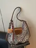 Bolso tote popular de estampado de leopardo estilo coreano diseño de nicho transfronterizo para mujer, gran capacidad, tendencia retro, bolso de un solo hombro, bolso de viaje
