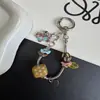 Cadena de hueso de serpiente para perro salchicha original correa para teléfono llavero lindo colgante de bolsa caricatura linda dopamina