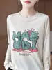 Nueva camiseta de punto casual de otoño para mujer con estampado de letras de dibujos animados, manga larga, cuello redondo, corte holgado, top fino y adelgazante