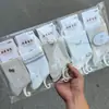 Calcetines Nuevos de Media Pantorrilla para Otoño e Invierno, Calcetines Deportivos, Letras Color Café Gracia, Mismo Color, Cómodos y Transpirables, Venta al por Mayor por Fabricante