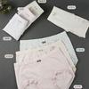 Ropa interior de mujer sin costuras de 32 pines de amoníaco desnudo integrada, tela de arena colorida 3D, cintura con lazo, archivo inferior antibacteriano de seda de morera