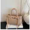 Bolso de diseño de nicho de alta gama para mujer 2026 nuevo bolso de mano elegante bolso cubo versátil de un solo hombro bandolera