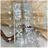 Set de Decoración para Uñas con Forma de Estrella de Mar y Concha de 12 Compartimentos 2026 Nuevo Estilo Concha Marina Cocotero Resina DIY Rhinestones Pequeños Accesorios para Uñas