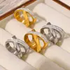 Anillo de diamantes en forma de X con personalidad simple, de venta caliente transfronteriza, estilo europeo y americano, diseño geométrico irregular, acero de titanio chapado en oro de 18 quilates.