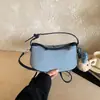 Primavera de 2026 Nova Moda Coreana Design de Nicho de Alta Qualidade Bolsa de Axila Moda Feminina Versátil para o Trabalho Bolsa de Ombro Único Transversal