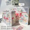 Colección de bolsas de regalo: engrosada, alto valor estético, cartulina blanca, gran capacidad, bolsa de mano de dibujos animados simple y exquisita