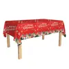 Conjunto de festa com tema de Natal: pratos de papel descartáveis, copos de papel, toalha de mesa, bandeirinhas, talheres e decorações festivas de festa