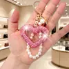 Llavero de Corazón Hueco con Pedrería Creativo Hecho a Mano Estilo Ins Versátil Colgante de Bolsa con Perlas en Forma de Corazón Regalo