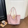 Bolso tote de rayas de alta gama japonés y coreano transfronterizo para mujer, nuevo bolso versátil para hombro y axila 2026, bolso de mano de gran capacidad