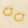 Nuevos Pendientes de Acero Inoxidable Dorado 18K Transfronterizos con Hebilla Redonda en Relieve de Moda Tendencia Estilo Europeo y Americano