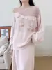 Conjunto de punto suave estilo francés 2026 otoño e invierno nuevo conjunto de dos piezas de suéter con flores tridimensionales + falda larga para mujer
