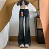 Jeans popular de botões duplos microflare para mulheres deste ano 2026 outono inicial novo estilo emagrecedor elástico não gruda nas pernas calças compridas boca de sino