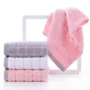 Toalla de lavado facial al por mayor para el hogar de algodón unisex toalla facial de algodón absorbente de pelusa toalla de baño empaque independiente