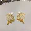Pendientes de Perla Calientes Calientes Aguja de Plata S925 Diseño de Nicho Lazo Dulce Estrella Fuegos Artificiales Dos Pendientes