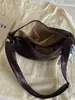 Bolso grande de mujer retro casual 2026 verano nuevo color liso bolsa de albóndiga simple para el trabajo hombro bandolera