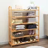 Un estante para zapatos de bambú de varias capas, zapatero simple para el hogar, a prueba de polvo, económico, estante de almacenamiento para dormitorio de dormitorio