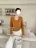Nuevo estilo coreano de moda versátil de cuello redondo y manga larga para mujer, top base holgado y adelgazante, otoño de 2026